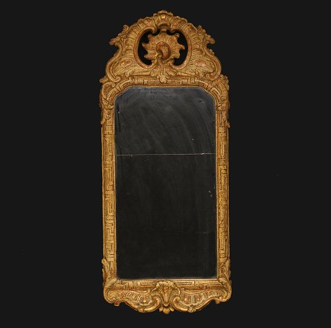 A gilt 18th century Rococo mirror. Sweden circa 
1760. H: 76cm. W: 33cm