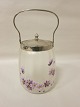 Biscuit-box made of glass with a lid of metal, 
antique
About 1900.
H: 26cm incl. the handle.