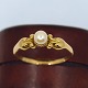 Antik 
Damgaard-
Lauritsen 
presents: 
Georg 
Jensen; Ring of 
18k gold, set 
with a pearl 
No. 180