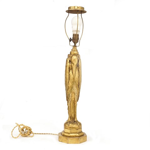 A woodcut and gilt Malibu stork table lamp. 
Denmark circa 1920. H: 75cm