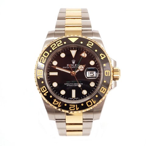 Rolex GMT Master II ref. 116713LN i 18kt guld og 
stål. Leveres i god stand med box og certifikat. 
Årgang 2014