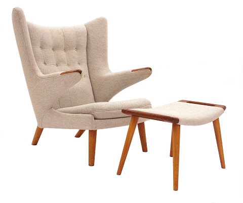 Hans J. Wegner “Papa Bear”. Wingback teak and oak 
easy chair with matching stool. AP 19 and AP 29