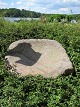 Saddle quern, carved in granite, antique, approximately 1850
We have a large choice of good, antique, Danish troughs, millstones, saddle 
querns etc.
Please contact us for further information