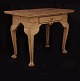 A light brown Rococo table. Denmark circa 1760. H: 77cm. Top: 90x61cm