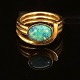 A 14ct gold opal ring. Size: 54. W: 8,9gr