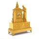 A gilt Empire mantel bronze clock. France circa 1820. H: 49cm. W: 36cm