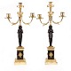 A pair of fire gilt Empire bronze candelabra. France circa 1820. H: 51cm