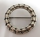 Georg Jensen. Silver brooch (925). Design Sigvard Bernadotte. Model 301. 
Diameter 35 mm. Produced 1933-1945