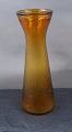 Antikkram 
præsenterer: 
Stort 
Hyacintglas, 
Zwiebelglas, 
Løg glas i 
brunt glas med 
netmønster 22cm