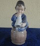 Antikkram 
präsentiert: 
Royal 
Copenhagen 
Dänemark, Figur 
Nr. 3689, Junge 
mit Blashorn