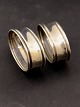 A pair of 
almost 
identical 
napkin rings