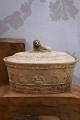 K&Co. presents: 
Antique 
oval empire 
faience tureen 
from 1810-40 
with fine 
decorations and 
a lion lying on 
the ...