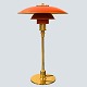 Antik 
Damgaard-
Lauritsen 
presents: 
Poul 
Henningsen; PH 
3/2 table lamp, 
with red 
lacquered shade