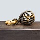 Antik 
Damgaard-
Lauritsen 
presents: 
Ole 
Lynggaard; 
Sweet drops 
charm in 18k 
gold, birdcage