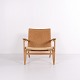 Osted Antik & Design präsentiert: CH25 Sessel aus Patinierter Massiver Eiche und Geflecht von Hans J. Wegner