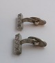 Lundin Antique präsentiert: W. Kr. Manschettenknöpfe aus Sterlingsilber (925). Länge 2,4 cm