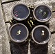 Swedish ceramics, set of 4 small mugs 6cm with black glaze and with decoration.