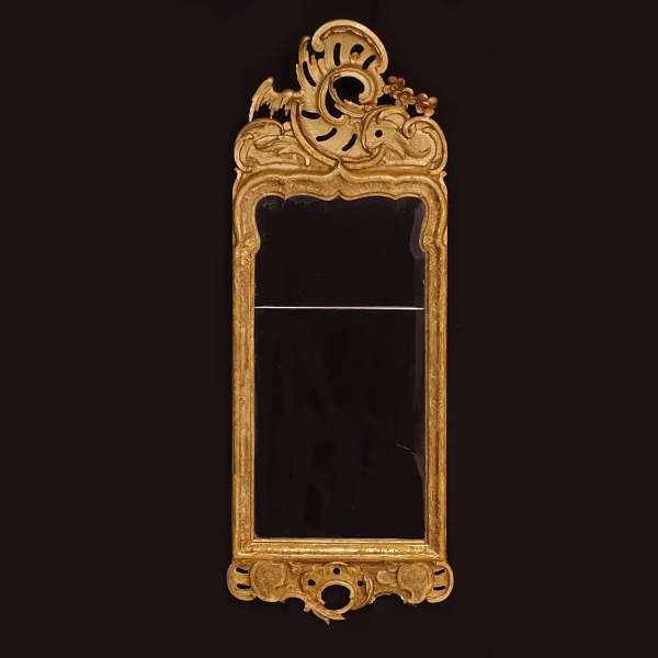 A gilt Danish Rococo mirror. Denmark circa 1750-60. H: 99cm. W. 38cm