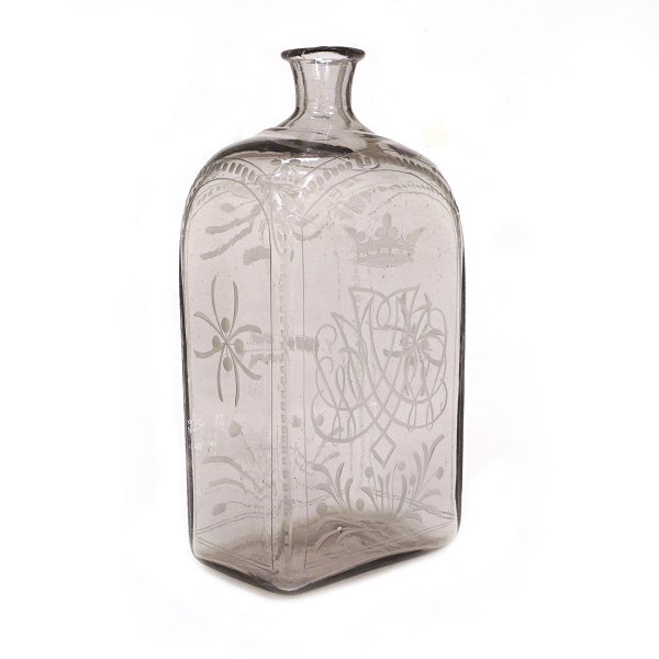 A large monogrammed glass bottle. Sweden or Norway circa 1820. H: 28cm