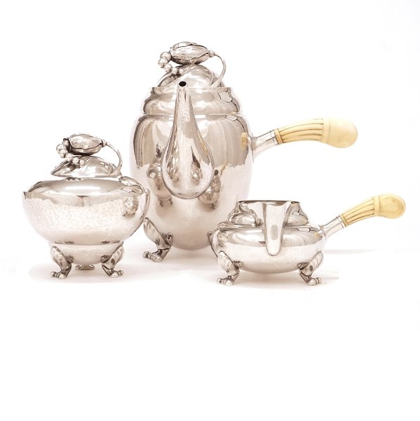 Vintage Georg Jensen Blossom Sterlingsilver coffee service design #2C (Coffee 
pot and creamer) and #2D (sugar bowl). Coffee pot H: 19,5cm