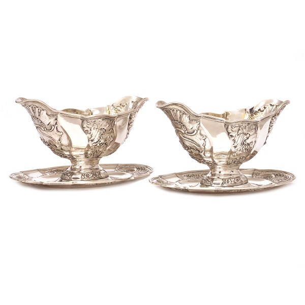Pair silver sauce boats by A. Michelsen, Copenhagen, dated 1898 & 1901. H: 13cm. 
L: 22cm. W: 1.244gr